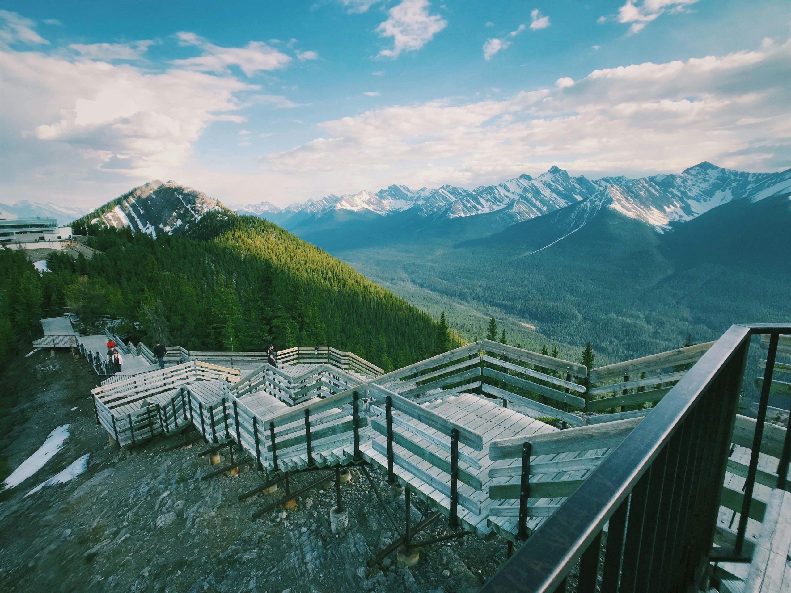 Captivating mountain view from a wooden stairway in Banff National Park, Canada.